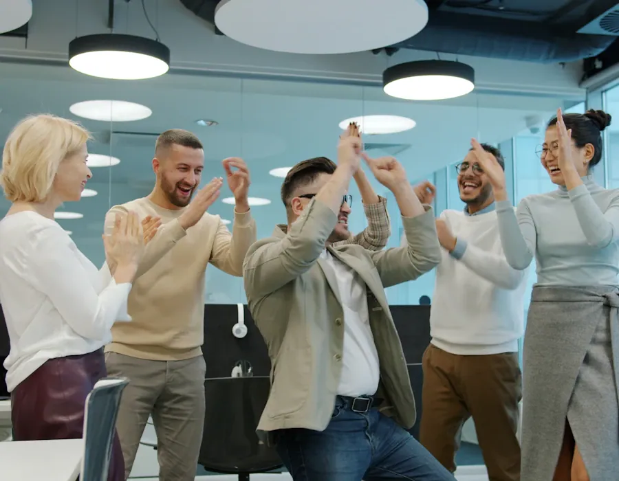 A team celebrating together in an office